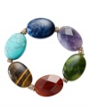 Show off your colorful personality with Lauren Ralph Lauren's large bead bracelet. With a stretchy base, it boasts semi-precious tiger's eye and amethyst colored beads. Crafted in gold tone mixed metal. Approximate length: 7-1/2 inches.