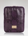 Protect your tablet with MICHAEL Michael Kors' patent python iPad case, complete with gleaming gold-tone logo plaque.