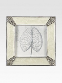 Masterful enameling has the look of lustrous mother-of-pearl in this elegant square frame with Swarovski crystals shimmering at each corner.Enamel and crystalWhite bronze finishHandmade, hand-enameled and hand-set2.75 square; holds a 2 square photoImported Masterful enameling has the look of lustrous mother-of-pearl in this elegant square frame with Swarovski crystals shimmering at each corner.Enamel and crystalWhite bronze finishHandmade, hand-enameled and hand-set2.75 square; holds a 2 square photoImported