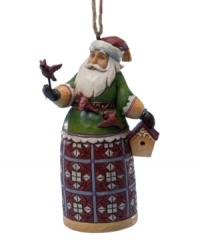 The folksy charm of this Santa and cardinal ornament by Jim Shore makes it a beautiful addition to your holiday collection. The folksy charm of this Santa and cardinal ornament by Jim Shore makes it a beautiful addition to your holiday collection.