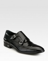 A double monk strap closure lends a modern, refined touch to a classic slip-on style, crafted in sleek, polished calfskin leather.Leather upperLeather liningPadded insoleRubber soleImported