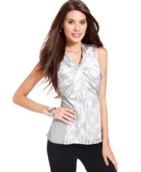 Alfani's sleeveless blouse features a unique twist detail at the neckline, a snake-inspired print, an exposed back zipper and a contrasting side and back panel. Alfani's sleeveless blouse features a unique twist detail at the neckline, a snake-inspired print, an exposed back zipper and a contrasting side and back panel.