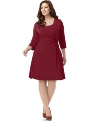 A slimming faux wrap silhouette beautifully defines NY Collection's three-quarter sleeve plus size dress-- be the beauty of the boardroom!