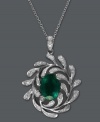 Autumnal bliss. Sweeping diamond-coated leaves (1/4 ct. t.w.) surround a stunning, oval-cut emerald (1-1/2 ct. t.w.) in this stunning pendant from Brasilica by Effy Collection. Set in 14k white gold. Approximate length: 18 inches. Approximate drop length: 1-1/10 inches. Approximate drop width: 4/5 inch.