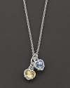 A twin heart necklace in canary crystal and blue quartz framed in sterling silver. Designed by Judith Ripka.