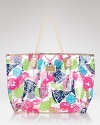A colorful party of lobsters, seashells and sailboats mingles with anchors and citrus slices on this beach-ready Lilly Pulitzer tote.