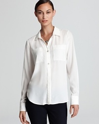 An essential Isaac Mizrahi Jeans shirt gets a contemporary reboot with sheer styling and relaxed tailoring. An essential Isaac Mizrahi Jeans shirt gets a contemporary reboot with sheer styling and relaxed tailoring.