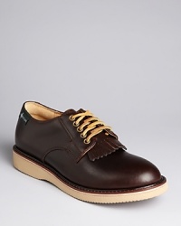 This new hybrid shoe marries a straightforward oxford with fringe detail at the tongue and boat shoe laces for a unique and dynamic design that puts you on solid ground. This new hybrid shoe marries a straightforward oxford with fringe detail at the tongue and boat shoe laces for a unique and dynamic design that puts you on solid ground.