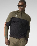 An active fusion of stretch microfiber and mesh, an essential jacket is designed for high performance and a sporty aesthetic with a protective mockneck collar and Coolmax® technology.