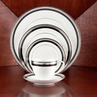 Intricately textured platinum rings on pure white china paired with the fashionably modern look of ebony creates a new sophistication for your table. Intricately textured platinum rings on pure white china paired with the fashionably modern look of ebony creates a new sophistication for your table.