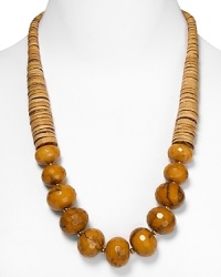 Tribal-inspired chic from RJ Graziano. This bold necklace marries graduated tan stone discs with multifaceted tiger's eye beads for a versatile piece that works well a black dress or dark jeans. Tribal-inspired chic from RJ Graziano. This bold necklace marries graduated tan stone discs with multifaceted tiger's eye beads for a versatile piece that works well a black dress or dark jeans.