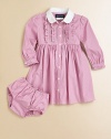 Classically preppy striped poplin with a touch of ruffles makes for a perfect dress for any occasion.Embroidered club collarLong puffed sleevesButton-frontGathered empire waistFull skirtCottonMachine washImported Please note: Number of buttons may vary depending on size ordered. 