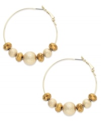 Clusters of gold tone diamond-blasted and faceted beads shine on these Alfani hoop earrings. Crafted in 12k gold-plated mixed metal. Approximate drop: 1-7/8 inches. Clusters of gold tone diamond-blasted and faceted beads shine on these Alfani hoop earrings. Crafted in 12k gold-plated mixed metal. Approximate drop: 1-7/8 inches.