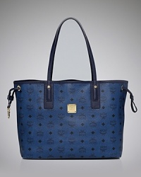 MCM pays homage to heritage style with this tote. A classic shape is day-right, while the bag's logo-printed exterior flaunts on-trend allure. MCM pays homage to heritage style with this tote. A classic shape is day-right, while the bag's logo-printed exterior flaunts on-trend allure.