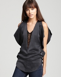 A virtual work of art, this silky-sensual Akiko top, dresses up denim thanks to the celestial flutter sleeves and delicate beaded detail that elevate this look from simple to stunning. A virtual work of art, this silky-sensual Akiko top, dresses up denim thanks to the celestial flutter sleeves and delicate beaded detail that elevate this look from simple to stunning.