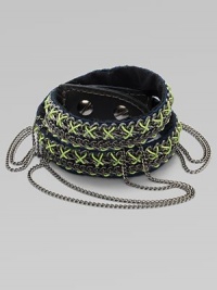 An edgy, street-smart design with oxidized links brightly stitched onto a double-wrap leather cuff with draped chains and a bold stud closure.LeatherGoldtoneCotton backingLength, about 16½Width, about 3Stud snap closureImported