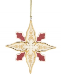 Crafted of lovely porcelain with gold and red embellishments, this star ornament sparkles upon your tree for an opulent look. From Lenox. Crafted of lovely porcelain with gold and red embellishments, this star ornament sparkles upon your tree for an opulent look. From Lenox.