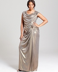 Gorgeously draped, this Tadashi Shoji Plus metallic gown touts a sparkling embellishment at the bodice for even more sparkle. Gorgeously draped, this Tadashi Shoji Plus metallic gown touts a sparkling embellishment at the bodice for even more sparkle.