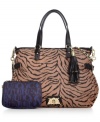 Take on the exotic trend with this tiger-print tote from Juicy Couture. Featuring luxe leather handles, signature accents and flirty tassels, it's easy to see why this look is so purr-fect.