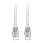 Inspired by a celebrated design of George Chevalier in the 1930s, Thomas Bastide's diamond-cut candlesticks feature interior ruffle cuts to maximize light dispersion.