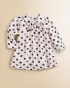 A precious cotton frock with Peter Pan collar and bold polka dots for your little girl.Peter Pan collar with bow tieLong sleevesBack buttonsCottonMachine washImported Please note: Number of buttons may vary depending on size ordered. 