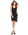 A stylishly slouchy shape and draped fringe trim adds a chic spin to this BCBGMAXAZRIA little black dress -- a soiree staple!