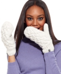 Keep hands completely cozy with these fleece-lined mittens from The North Face. Dressed in classic cable knit, they're at once classic and contemporary. Keep hands completely cozy with these fleece-lined mittens from The North Face. Dressed in classic cable knit, they're at once classic and contemporary.