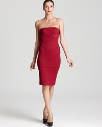 Sheer mesh panels and a body-con silhouette create a high impact look from this Zac Posen dress, structured at the bustline for sharp, resounding style. Sheer mesh panels and a body-con silhouette create a high impact look from this Zac Posen dress, structured at the bustline for sharp, resounding style.