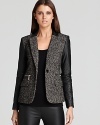 Faux leather sleeves punk up a tweed MICHAEL Michael Kors jacket for an edgy approach to everyday style. Keep the look strong with sleek, monochrome separates.