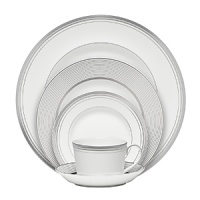 World-renowned fashion designer Monique Lhuillier collaborated with Waterford to create this fine bone china dinnerware collection. Drawing inspiration from the artful details that finish Lhuillier's brilliant couture bridal gowns, each piece in the assortment is decorated with polished platinum accents in a raised stitching design.