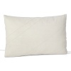 An earthy, simply detailed pillow with stitched lines over a fine mesh netting.