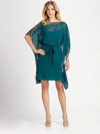 This chiffon caftan silhouette is defined by alluring shoulder slits and dazzling sequined trim.BoatneckSplit shouldersCaftan sleevesTie beltSequined trimFully linedAbout 19 from natural waistPolyesterSpot cleanImportedModel shown is 5'10 (177cm) wearing US size 4. This chiffon caftan silhouette is defined by alluring shoulder slits and dazzling sequined trim.BoatneckSplit shouldersCaftan sleevesTie beltSequined trimFully linedAbout 19 from natural waistPolyesterSpot cleanImportedModel shown is 5'10 (177cm) wearing US size 4.
