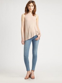 Hi-low ruffle hem adds feminine charm to this lightweight basic. CrewneckSleevelessHi-low ruffle hemViscoseMachine washMade in USAModel shown is 5'10 (177cm) wearing US size Small. Hi-low ruffle hem adds feminine charm to this lightweight basic. CrewneckSleevelessHi-low ruffle hemViscoseMachine washMade in USAModel shown is 5'10 (177cm) wearing US size Small.