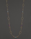 Faceted oval amethyst and blue topaz add rich sparkle to 14K yellow gold. By Nancy B.