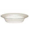 Dress up any veggies or sides with this fine china serving dish. From innovative designer Monique Lhullier, it features a pearlescent border with glossy raised dots and a fine stitch-like pattern.
