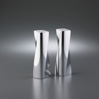 Twist Max Salt & Pepper set is modern and constructed of Nambe's signature metal, offering a grander statement than the original Twist Salt and Pepper Shaker set. Designed in a dynamic helix shape, the form presents new angles constantly. The non-tarnishing metal and the fantastic design will encourage you to keep this pair on the table even after the meal is through. 5 in height.