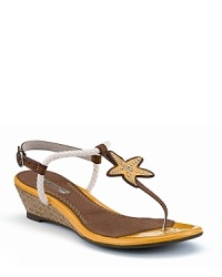 A sea-bound starfish tops these t-straps, equipped with a foam-cushioned footbed for all-day comfort. By Sperry. A sea-bound starfish tops these t-straps, equipped with a foam-cushioned footbed for all-day comfort. By Sperry.