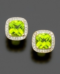 The fun and fresh color of cushion-cut peridot (2-5/8 ct. t.w.) shines brightly within a border of sparkling round-cut diamonds (1/4 ct. t.w.). Set in 14k gold.