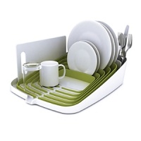 The ingenious concentric design of this compact Joseph Joseph dishrack holds a kitchen's worth of dishes and utensils. The sloping base channels water away, while an integrated spout drains directly into the sink. The ingenious concentric design of this compact Joseph Joseph dishrack holds a kitchen's worth of dishes and utensils. The sloping base channels water away, while an integrated spout drains directly into the sink.