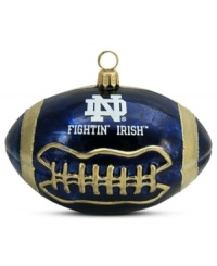 Team and Christmas spirit go hand in hand with the Notre Dame football ornament. Hand-painted glass is something students, alum and fans will cheer. Team and Christmas spirit go hand in hand with the Notre Dame football ornament. Hand-painted glass is something students, alum and fans will cheer.
