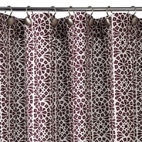 A geometric, leaf-like print in metallic silver. A geometric, leaf-like print in metallic silver.