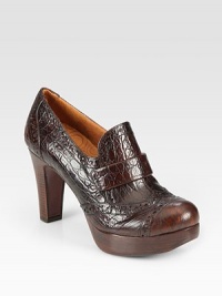 Loafer-inspired platform staple of crocodile-embossed leather with perforated details and a towering stacked heel. Stacked wooden heel, 3¾ (95mm)Wooden platform, 1 (25mm)Compares to a 2¾ heel (70mm)Crocodile-embossed leather upperLeather liningLeather sole with rubber insertPadded insoleMade in Spain Loafer-inspired platform staple of crocodile-embossed leather with perforated details and a towering stacked heel. Stacked wooden heel, 3¾ (95mm)Wooden platform, 1 (25mm)Compares to a 2¾ heel (70mm)Crocodile-embossed leather upperLeather liningLeather sole with rubber insertPadded insoleMade in Spain