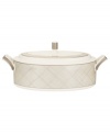 Dressed in a fine diamond grid of bronze and warm taupe, this covered vegetable server is tailored for formal dining and everyday elegance. Squared handles architect a sophisticated silhouette to enhance more classic bone china essentials. From Noritake's collection of serveware and serving dishes.