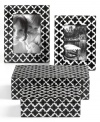 In classic black and white hues, this Purva jewelry box set will easily coordinate with any room decor. Features a floral-inspired quatrefoil design for a chic allure.