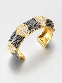 Shimmer meets serpent in this stunning open cuff of tejus lizard, punctuated by concave hearts paved with dazzling crystals.CrystalLizardGoldplated brassDiameter, about 2.5Width, about 1Made in USA Shimmer meets serpent in this stunning open cuff of tejus lizard, punctuated by concave hearts paved with dazzling crystals.CrystalLizardGoldplated brassDiameter, about 2.5Width, about 1Made in USA