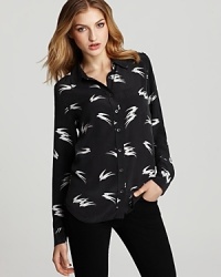 In luxe silk, this Equipment blouse, with its abstract bird print, infuses a sense of artistic beauty into your every day. In luxe silk, this Equipment blouse, with its abstract bird print, infuses a sense of artistic beauty into your every day.