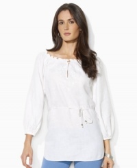 This breezy Lauren by Ralph Lauren tunic is rendered in lightweight linen with delicate embroidery and smocking at the neckline for a bohemian look. This breezy Lauren by Ralph Lauren tunic is rendered in lightweight linen with delicate embroidery and smocking at the neckline for a bohemian look.