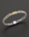Caviar rope bracelet with gold bar stations and central diamond pavé station. Designed by Lagos.