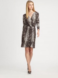 Behold, the most flattering silhouette around. This printed dress features a faux-wrap front to complement the neckline and a tulip skirt to accentuate legs.V-necklineThree-quarter sleevesPleated, faux-wrap frontAllover printTulip skirtPull-on styleAbout 22 from natural waist94% polyester/6% spandexMachine washImported Model shown is 5'10½ (179cm) wearing US size Small. Behold, the most flattering silhouette around. This printed dress features a faux-wrap front to complement the neckline and a tulip skirt to accentuate legs.V-necklineThree-quarter sleevesPleated, faux-wrap frontAllover printTulip skirtPull-on styleAbout 22 from natural waist94% polyester/6% spandexMachine washImported Model shown is 5'10½ (179cm) wearing US size Small.