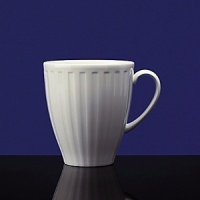 Simple shapes of crisp white are accented with precisely etched lines. Contrasting black matte jasper accessories with glazed interiors are also available. Bone china. Simple shapes of crisp white are accented with precisely etched lines. Contrasting black matte jasper accessories with glazed interiors are also available. Bone china.